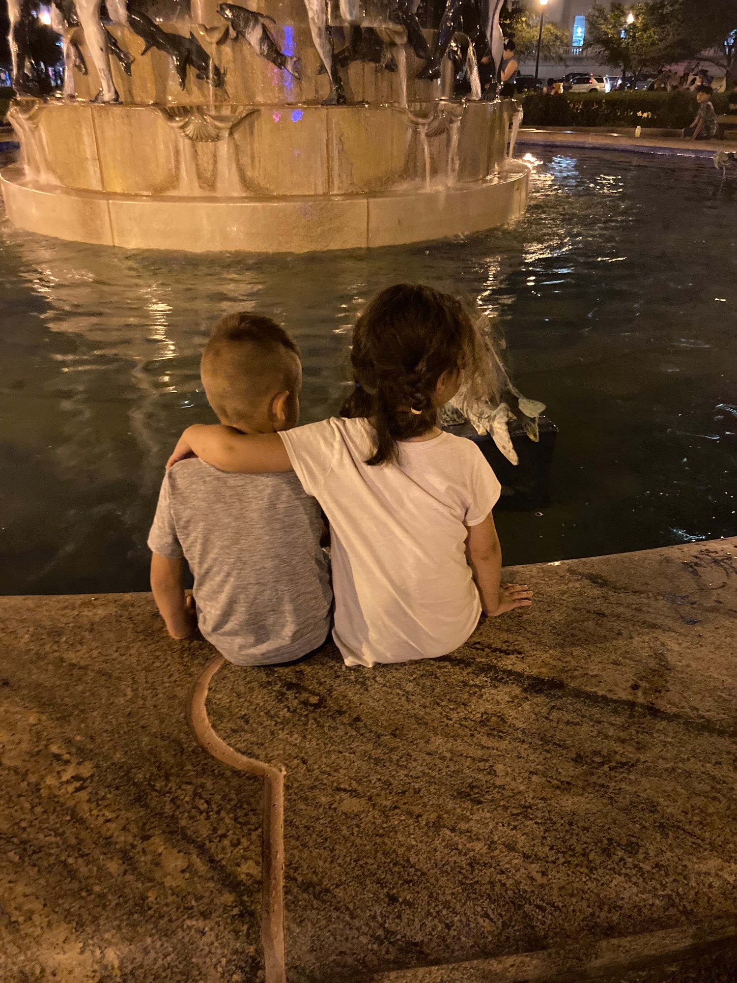 Sis And Bubba Sitting At A Fountain